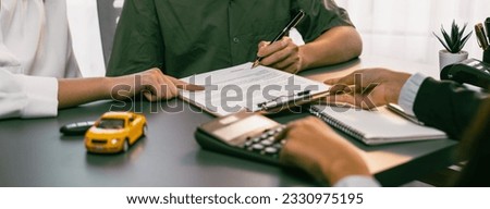 Car dealer calculate interest rate and costs of car loan with calculator, explaining details to customer on term and agreement in dealership office, offering financial and insurance service. Prodigy
