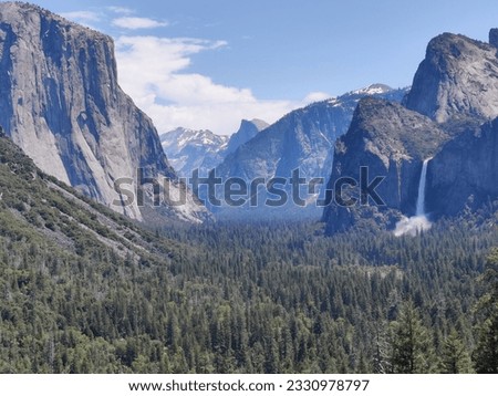 The classic Yosemite scenery . 
This picture has all the elements of nature , The view is just breathtaking and a perfect background or wallpaper picture for any nature lover 