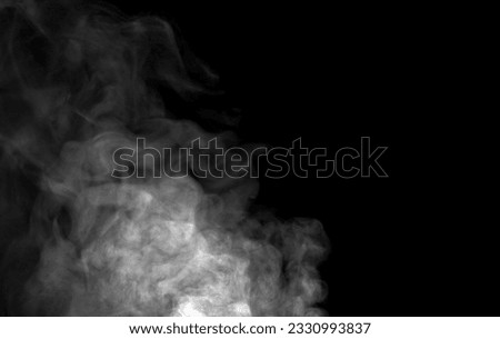 Mystery black and white smoke isolated on black background.
