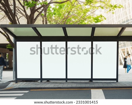 Blank white Banner mock up Media Advertisement set at bus stop City street Royalty-Free Stock Photo #2331001415