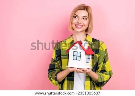 Portrait of pretty minded person hands hold little house look empty space isolated on pink color background