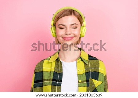 Portrait of adorable carefree lady closed eyes chill listen music headphones isolated on pink color background