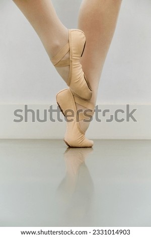 Close up of ballerina legs in ballet shoes. Ballet school or dance studio. Royalty-Free Stock Photo #2331014903