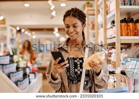 Customer using smartphone to buy cosmetics Royalty-Free Stock Photo #2331020101