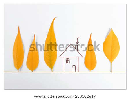 Autumn leaves with painted house on white paper
