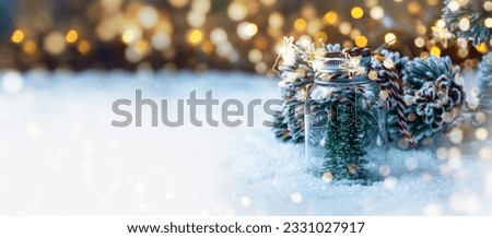 Christmas Winter background with Christmas tree in snow and magic bokeh lights - xmas panorama, banner , header with copy space - Winter Landscape abstract