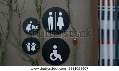 Public toilet sign. Woman, men, children, baby diaper changing, and disabled person toilet icon on restroom wall. Public restroom universal icon. Disabled access symbol. Latrine or WC. Washroom sign.