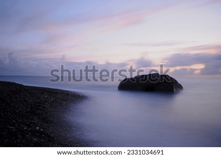 Old Bunker in the sea - longtime exposure  Royalty-Free Stock Photo #2331034691