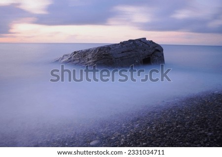 Old Bunker in the sea - longtime exposure  Royalty-Free Stock Photo #2331034711
