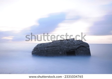 Old Bunker in the sea - longtime exposure  Royalty-Free Stock Photo #2331034765