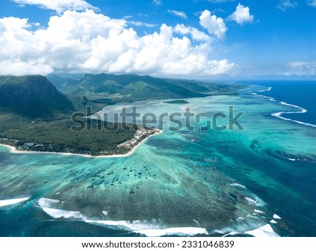 Incredible view of the famous underwater waterfall and Le Morne mountain in Mauritius. Picture taken from drone