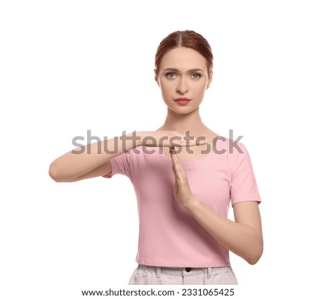 Woman showing time out gesture on white background