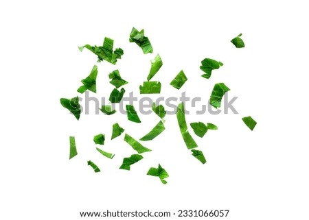 Fresh chopped parsley on a white background, top view. Chopped parsley leaves isolated on white background, top view. Chopped cilantro leaves, raw garden parsley. Royalty-Free Stock Photo #2331066057