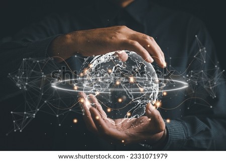Connected in Digital Era, Businessman hand holds globe, illustrating interconnectedness facilitated by technology. Big data analytics and business intelligence revolutionize global decision processes.