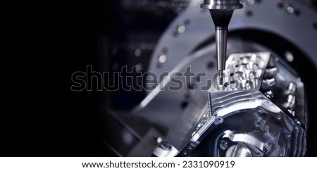 The 5-axis CNC mills machines for design configuration that utilizes a swivel head machine table and flush with the surface metalworking industrial, copy space Royalty-Free Stock Photo #2331090919