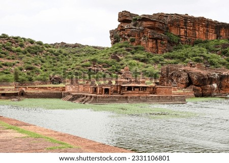 olly religious lake with ancient temple and mountain background at morning image is showing the beauty of Bhutanatha Temple on the shores of Agastya Tirtha at Badami, karnataka, india.