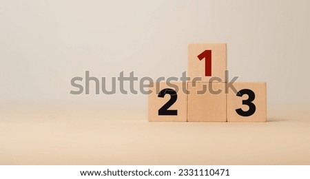 Number 1 on the podium with number 2, 3 of wooden building blocks. Ranking, business strategy, leader market, competitive advantage, benchmarking concept. Winner, leader, target achievement, success. Royalty-Free Stock Photo #2331110471