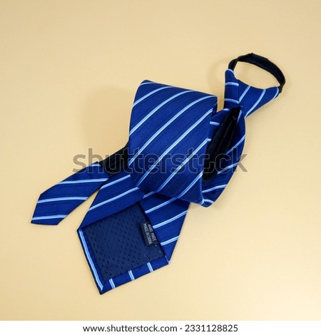 rolled zipper tie isolated on plain background close up view single object concept nobody 