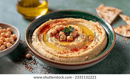 Velvety Hummus Made From Chickpeas, Tahini, Olive Oil, And A Touch Of Spice, A Dip That Never Fails To Impress Royalty-Free Stock Photo #2331132221