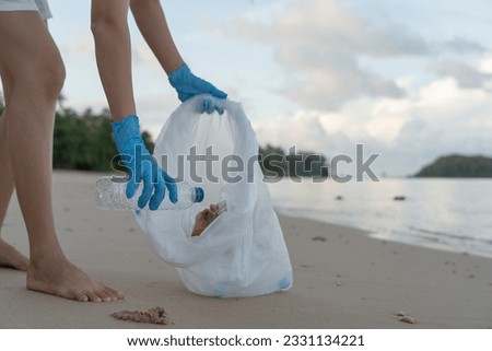 Save ocean. Volunteer pick up trash garbage at the beach and plastic bottles are difficult decompose prevent harm aquatic life. Earth, Environment, Greening planet, reduce global warming, Save world
 Royalty-Free Stock Photo #2331134221