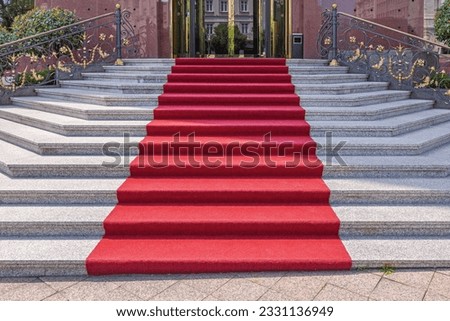 Red Carpet at Marble Stairs Entrance to Historic Hotel Building Royalty-Free Stock Photo #2331136949