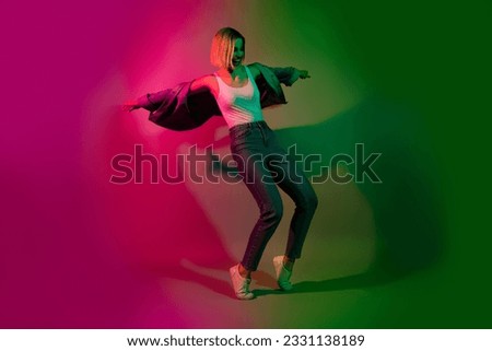 Full size photo of crazy youngster lady enjoy dancing futuristic weekend night club isolated on gradient vibrant neon color background