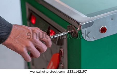 Man play pinball game. Vintage old and rusty green pinball table machine. Adult male hit ball and start game. Royalty-Free Stock Photo #2331142197