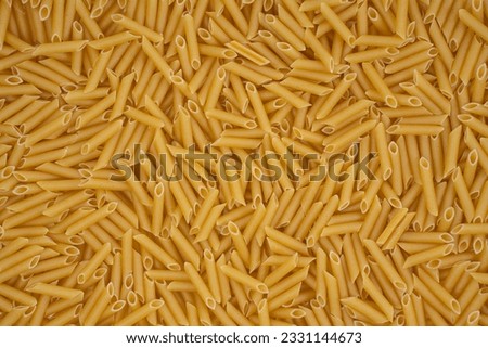 Top view Background image with dry macaroni noodles Royalty-Free Stock Photo #2331144673