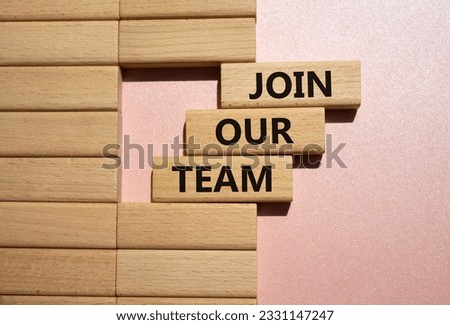 Join our team symbol. Wooden blocks with words Join our team. Beautiful pink background. Business and Join our team concept. Copy space.