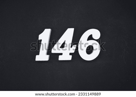 No. 146, made of white painted wood. Put it on a wooden board that is sprayed black as a background.