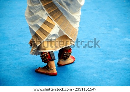 The footsteps of an Indian classical female dancer performing in a outdoor dancing concerts in an afternoon in the city of Kolkata,west Bengal, India, on 06.20.2023.