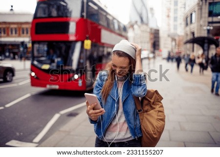 Young woman walking on the street in london