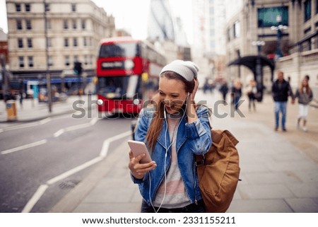 Young woman walking on the street in london