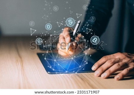 Businessman in casual wear typing on taplet with digital pen. Concept of distant work, business education, internet surfing,information technology. Blockchain investment hologram.