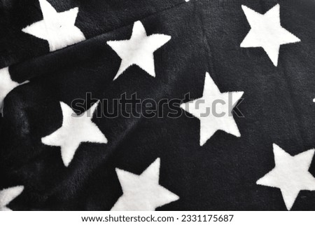 close-up view of a towel black with starts white Royalty-Free Stock Photo #2331175687