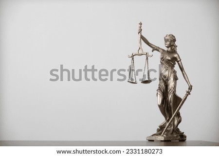 statue of god Themis Lady Justice is used as symbol of justice within law firm to demonstrate truthfulness of  facts and power to judge without prejudice. Themis Lady Justice is of justice. Royalty-Free Stock Photo #2331180273