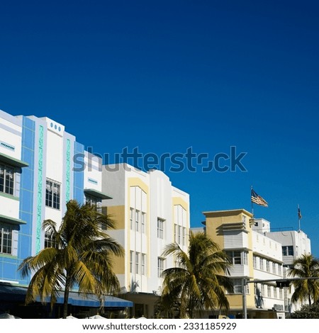 Palm trees and buildings in art deco district of Miami, Florida, USA.