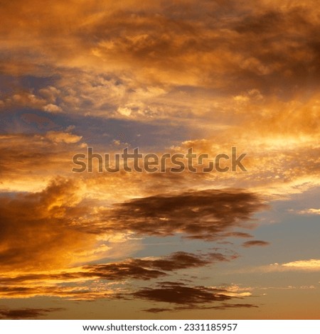 Golden clouds in sky with sunset.