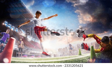 Children's professional soccer players workout with coach on the grand stadium Royalty-Free Stock Photo #2331205621