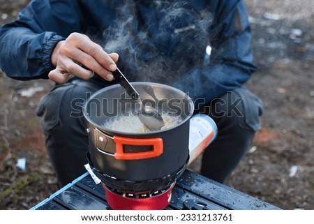 Cook instant noodles while camping in nature