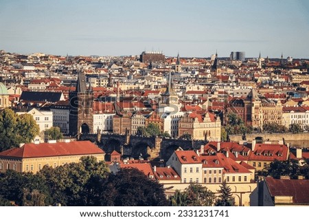 Old Town of Prague under the warm rays of the setting sun illuminating the rooftops of historic buildings in the capital of the Czech Republic. The centre of Prague.