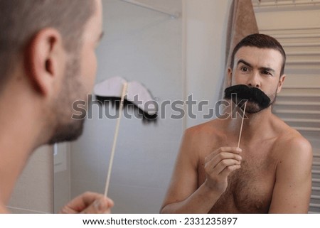 Man pretending to have a vintage mustache 