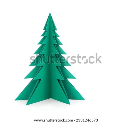 Green paper tree on a white background. Clipping patch