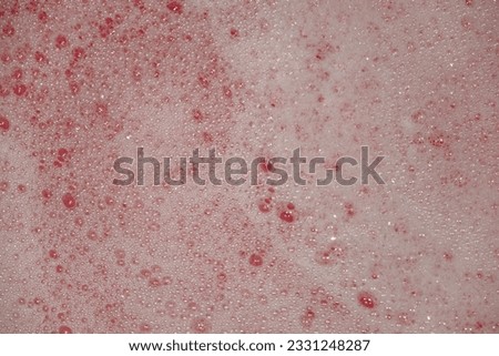 
Abstract white foam background on pink background