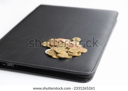 Coins, black wallet on the table. Crime for rent payment. Prosecutor's report. Make money by business idea concept image close up. Concept image of buying a house