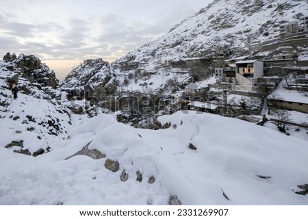 A view of Darband tourist village in the north of Tehran city at sunrise can be seen in the picture. This village has long been a climbing route to reach the Tochal peak.