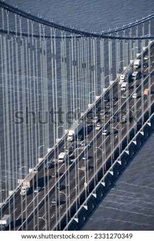 Aerial view of New York City-s Verrazano-Narrow-s bridge with traffic.
