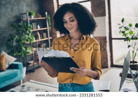 Photo of sweet good mood lady investor wear shirt smiling reading documents indoors workplace workstation