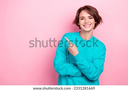 Photo of nice woman promoter directing finger empty space poster sale shopping center offer isolated pink color background