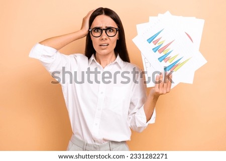 Photo of shocked impressed lady wear white shirt spectacles rising fail statistics documents isolated beige color background Royalty-Free Stock Photo #2331282271